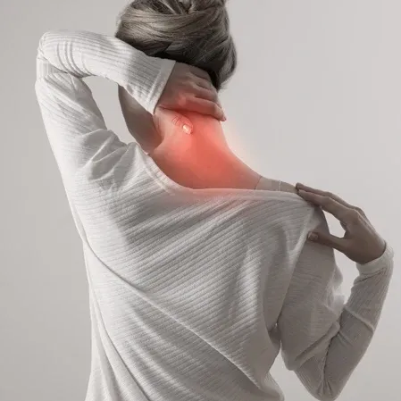 Person holding the back of the neck with a red highlighted area indicating discomfort in the neck region.